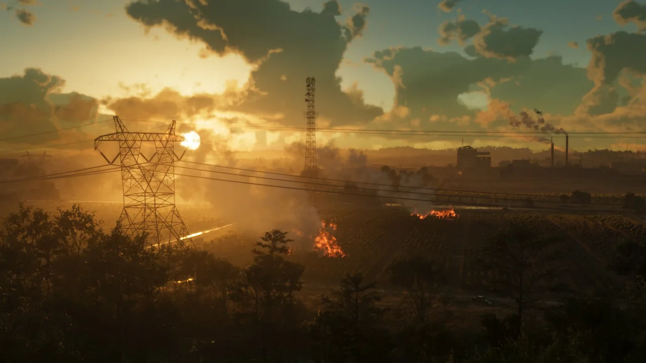 Pylônes électriques et champs en feu au coucher du soleil, des cheminées d’usine à l’horizon, capture officielle de GTA VI