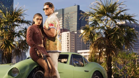 Jason et Lucia devant le coupé vert rapproché d’un Kellison J4 dans le visuel Ultimate Edition
